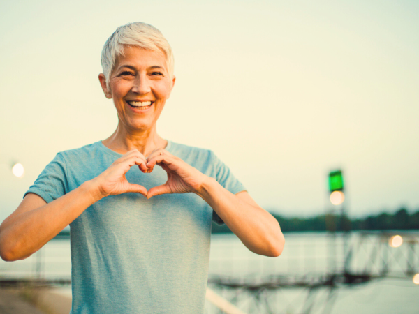 A women joining hands in a heart