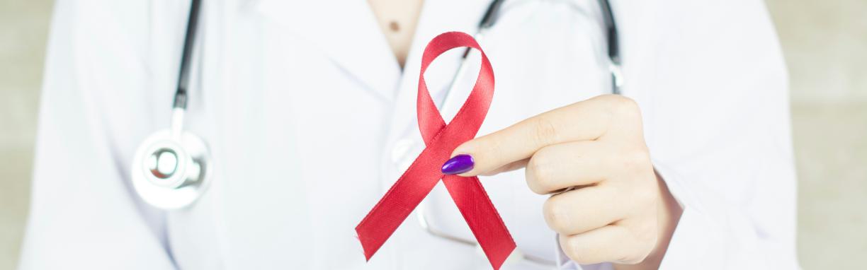 doctor with ribbon for cancer